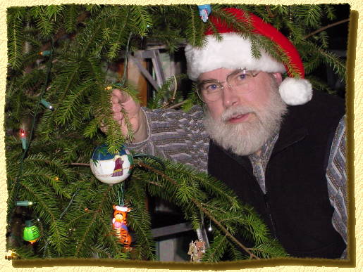 Norm adding his new ornament to the tree on 12/20/00.