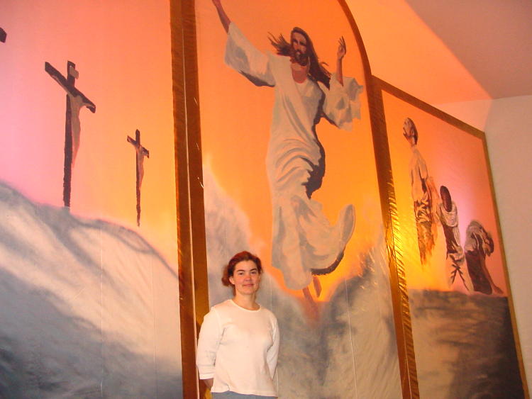 Paula McCreary with the painting she made during the service