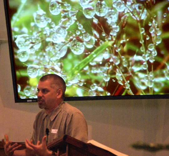 Pastor Phil Stevenson using a water drops illustration
 while preaching "Stephen and His Crime" - 6/1/08